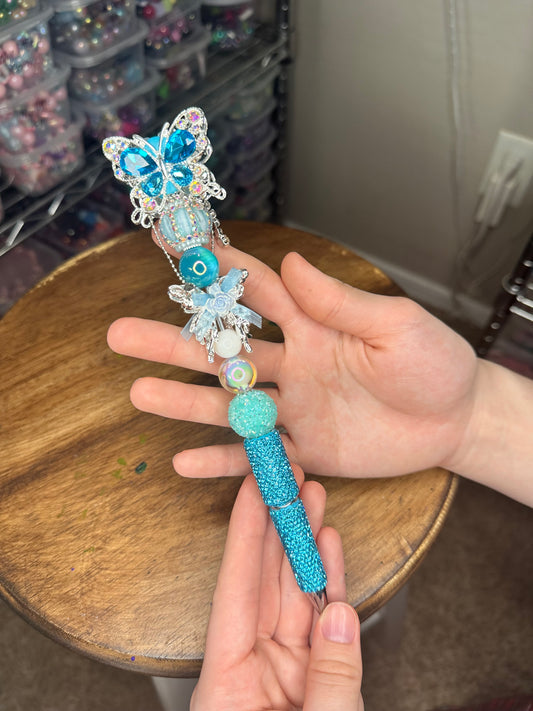 Icy Blue Rhinestone Butterfly Luxe Pen – Statement Edition

$20